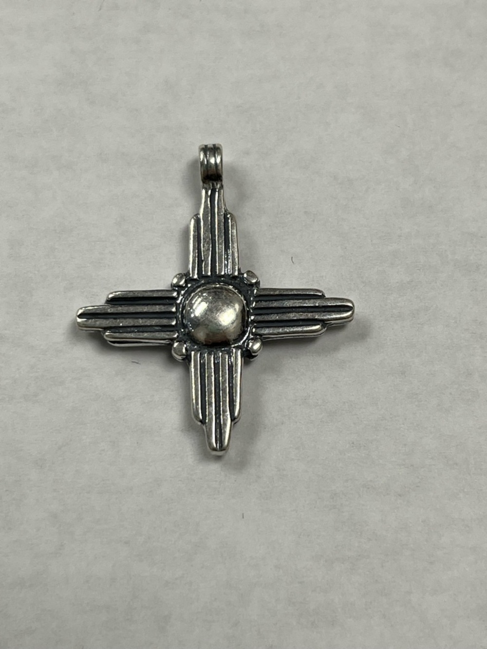 Sterling Silver Zia symbol pendant. Southwestern. Handmade.